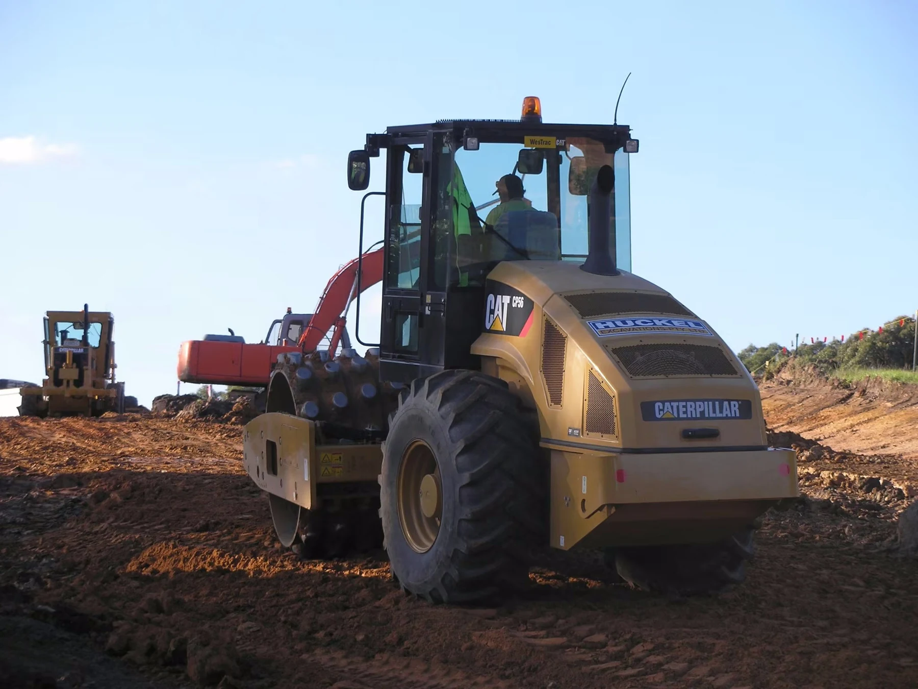 Huckel-branded roller and earthmoving machinery working on site