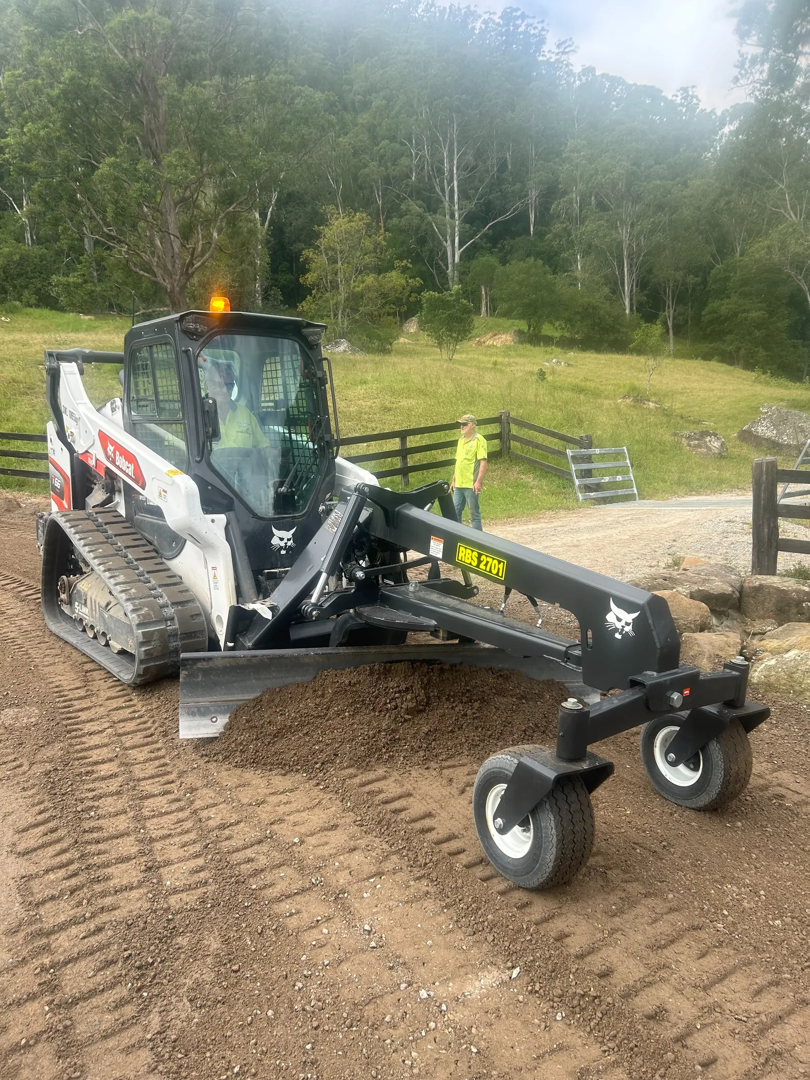 Huckel Positrac preparing and levelling soil on a rural property